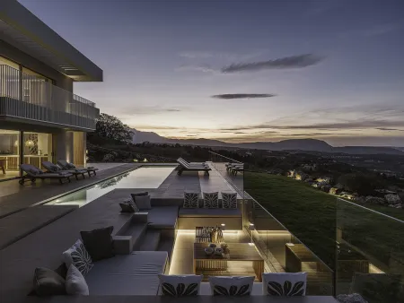  pool and outdoor sitting area at night