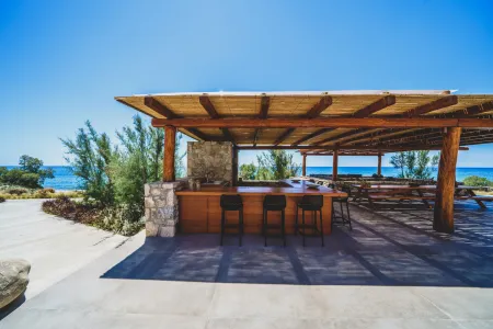  Bar seating area with high chairs near BBQ