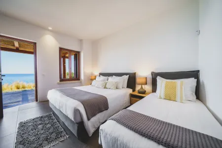 Double and single beds with balcony sea view