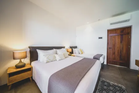  Bedroom with double and single bed, wooden door