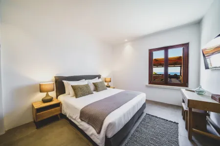  Room with window overlooking outdoor seating area